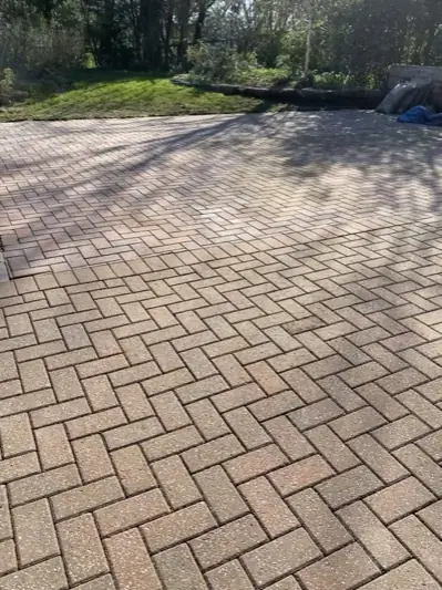 The same driveway cleaned, block paving colour restored
