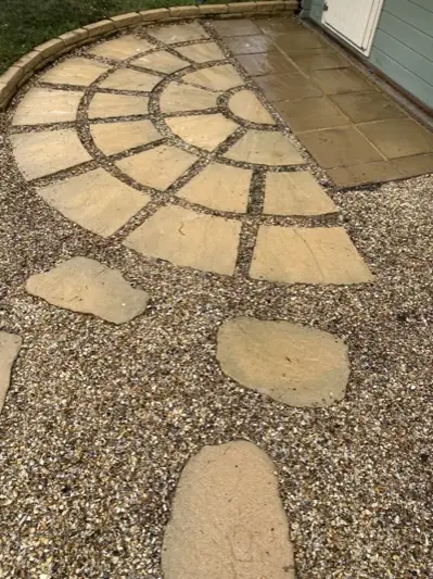 The same patio circle cleaned back to golden sandstone